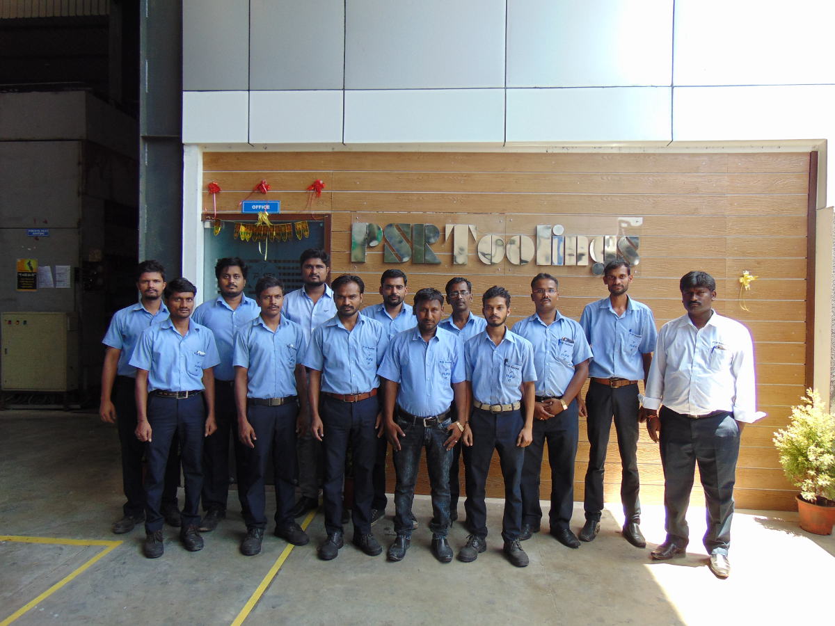 PSR Toolings shop-floor team at the office entrance